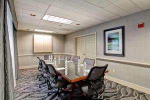 a conference room with a long table and chairs at Homewood Suites by Hilton Newark-Cranford in Cranford