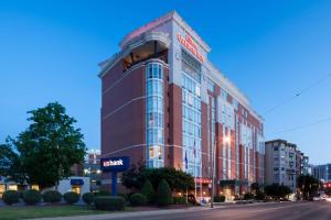 a building with a sign on the side of a street at Hilton Garden Inn Nashville Vanderbilt in Nashville