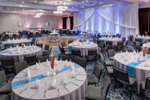 a banquet hall with white tables and chairs at Hilton Garden Inn Nashville Vanderbilt in Nashville +68 photos