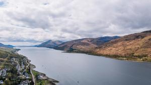 an aerial view of a large body of water with mountains at Muthu Fort William Hotel in Fort William