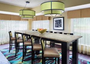 a large dining room with a large table and chairs at Hampton Inn Dallas Irving Las Colinas in Irving