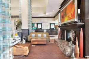 a living room with a fireplace and a couch at Hilton Garden Inn Denver Highlands Ranch in Highlands Ranch