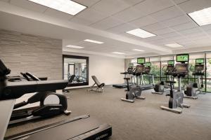 a gym with treadmills and elliptical machines at Courtyard Charlotte Airport North in Charlotte