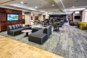a lobby with couches and tables and a bar at Courtyard by Marriott Abilene Southwest/Abilene Mall South in Abilene