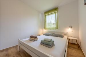 Posteľ alebo postele v izbe v ubytovaní Houses Trinetta