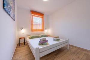 Posteľ alebo postele v izbe v ubytovaní Houses Trinetta