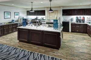 a large kitchen with a large island in the middle at Homewood Suites by Hilton Mahwah in Mahwah