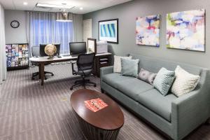 a living room with a couch and a desk with a computer at Homewood Suites by Hilton Mahwah in Mahwah