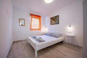 Posteľ alebo postele v izbe v ubytovaní Houses Trinetta
