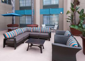 a patio with couches and chairs and a table at Hampton Inn San Diego Downtown in San Diego