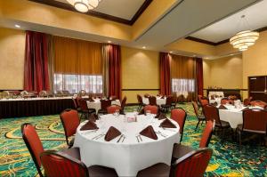 a large banquet room with tables and chairs in it at Hilton Garden Inn Shreveport Bossier City in Bossier City