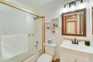 a bathroom with a toilet and a sink and a mirror at 1 Mi to Northstar Village Pet-Friendly Condo! in Truckee +19 photos