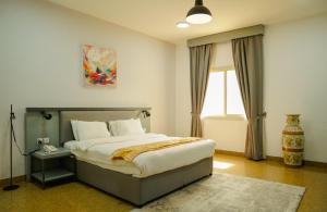 Ένα ή περισσότερα κρεβάτια σε δωμάτιο στο Safeer International Hotel By Brothers International