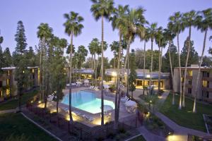 an aerial view of a resort with a pool and palm trees at DoubleTree by Hilton Phoenix- Tempe in Tempe