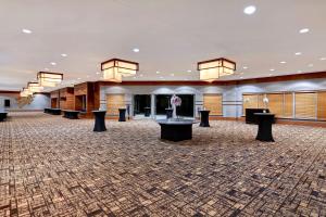 a large lobby with a large room with tables and chandeliers at DoubleTree by Hilton Phoenix- Tempe in Tempe