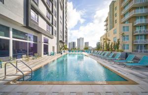 a swimming pool in the middle of a building at Home2 Suites By Hilton Ft. Lauderdale Downtown, Fl in Fort Lauderdale