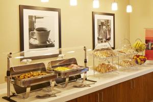 a buffet line with many different types of food at Hampton Inn San Diego Mission Valley in San Diego