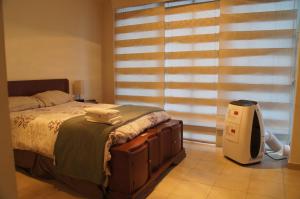 Postel nebo postele na pokoji v ubytování Lujoso Penthouse en la Roma