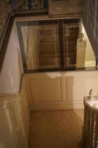 a stairway with a glass cabinet in a room at Yalı Beach Houses in Istanbul