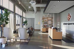 an office with chairs and tables in a lobby at Tapestry By Hilton The Fort Sutter Hotel Sacramento, Ca in Sacramento