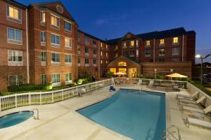 a swimming pool in front of a building at Homewood Suites by Hilton Houston - Northwest/CY-FAIR in Houston