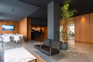 a dining room with a table and chairs at Hotel Maroa Vigo in Vigo