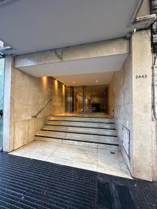 a building with stairs leading to a building at 2 ambientes moderno y muy bien ubicado in Buenos Aires