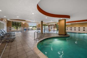 a pool in the lobby of a hotel at Hilton Garden Inn Rockford in Rockford