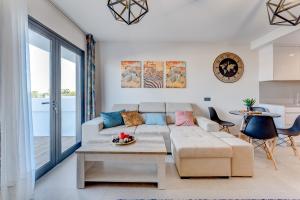 a living room with a couch and a table at Yuli in Puerto de la Cruz