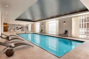 a large swimming pool in a building at Hilton Chicago Magnificent Mile Suites in Chicago