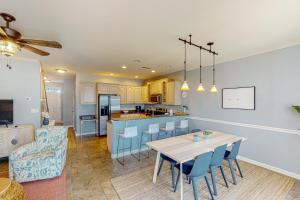 a kitchen and living room with a table and chairs at The Tides --- 19979 Sandy Bottom Cir, Unit #502 in Rehoboth Beach