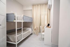 Postel nebo postele na pokoji v ubytování Residenza esposito + 85 fotografií