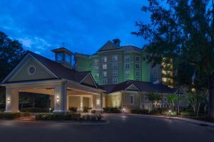 a large green building with a driveway at Homewood Suites by Hilton Raleigh/Crabtree Valley in Raleigh