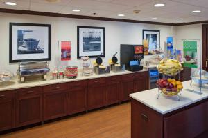 a store with a counter with a bowl of fruit on it at Hampton Inn & Suites Bethlehem in Bethlehem