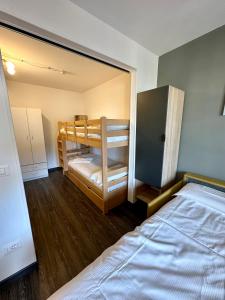 a bedroom with a bunk bed and a bedvisor at Stay in Cervinia Deluxe Apartment in Breuil-Cervinia