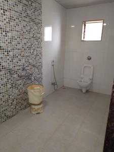 a bathroom with a toilet and a sink at ROYAL HERITAGE in Mahabaleshwar