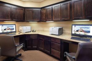 a office with two monitors and a computer on a desk at Hampton Inn Sweetwater in Sweetwater