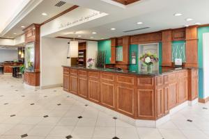 a lobby of a hospital with a counter with flowers at Hilton Garden Inn Austin North in Austin