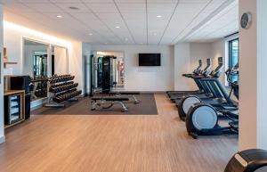 a gym with several treadmills and exercise bikes at Hilton Garden Inn Austin University Capitol District in Austin