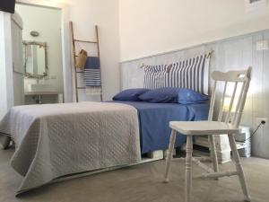 Rúm í herbergi á B&B Sperlonga