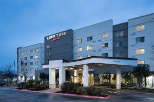 a rendering of the front of a hotel at Courtyard Austin North/Parmer Lane in Austin