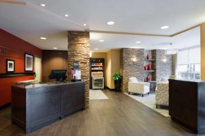 a lobby with a reception desk in a hotel at Hampton Inn Manhattan - Times Square South in New York