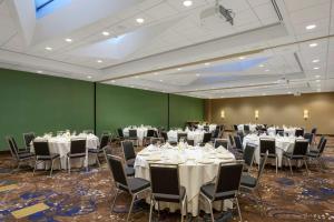 a banquet room with white tables and chairs at Hilton Garden Inn Washington DC/Georgetown Area in Washington