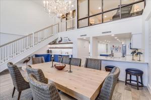 a dining room with a wooden table and chairs at 8th Floor Penthouse Luxury Beautifully Remodeled in Port Aransas