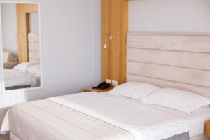 Postel nebo postele na pokoji v ubytování Hotel GRINT