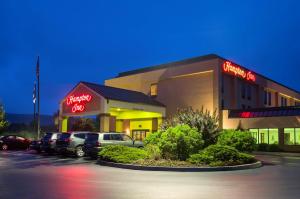 a shopping center with cars parked in a parking lot at Hampton Inn Danville in Danville