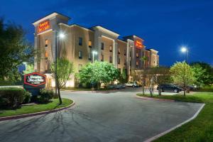 a hotel with a parking lot in front of it at Hampton Inn & Suites Austin South Buda in Buda