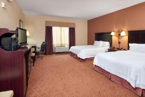 Postel nebo postele na pokoji v ubytování Hampton Inn & Suites Austin South Buda