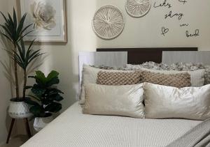 a bed with white sheets and pillows in a bedroom at Peaceful Fully Equipped 3BR Villa in Arima