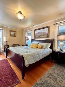 a bedroom with a large bed in a room at Historical Home, near wineries, weddings & shops in Snohomish
